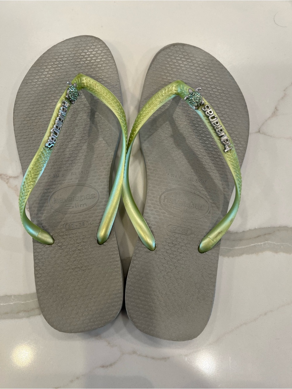 Havaianas Slim Flip Flops in Gray with Green Iridescent Straps